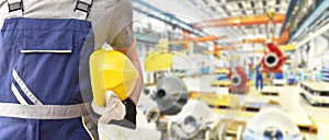 Workers with equipment in a factory - closeup