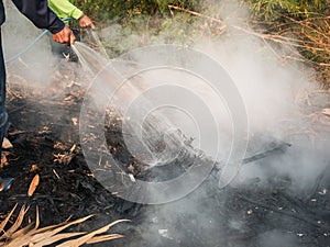 Workers Extinguish Fire with Water