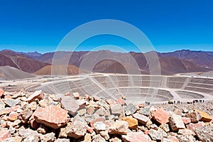 workers extracting rare earth metals in an open-pit mine