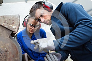 workers in factory on machine