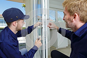 workers fitting a window