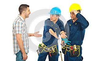 Workers giving explanations to a client