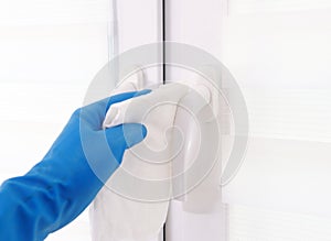 The workers hand wipes the window. Maid or housewife takes care of the house. Spring general or regular cleaning. The concept of a