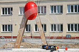 Workers helm on stepladder