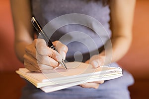 Workers hold a pen, note the work on the notebook.