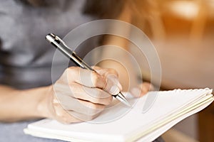 Workers hold a pen, note the work on the notebook.