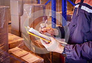 Workers Holding Clipboard Doing Inventory Management Package Boces in Storage Warehouse. Supply Chain Shipment. Shipping Cargo Box