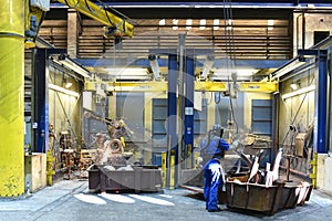 Workers in an industrial plant - workplace foundry - production of steel castings