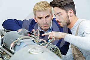 workers on industrial steam boilers
