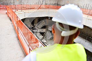 Workers inspecting construction works on a scaffold