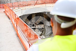 Workers inspecting construction works on a scaffold