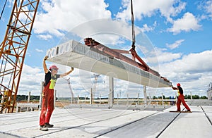 Workers installing concrete slab