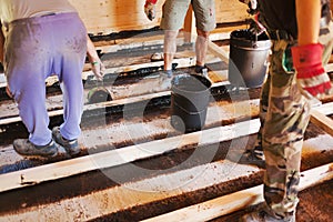 Workers installing a house foundation