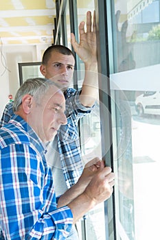 Workers in installing new window