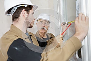 Workers installing window