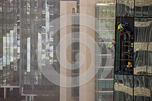 Workers Installing A Window On Skyscraper 