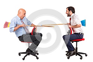 Workers jousting in office chairs