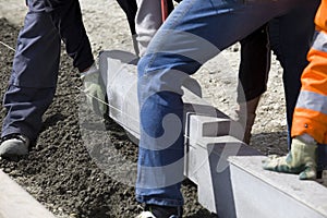 Workers laying breeze blocks photo