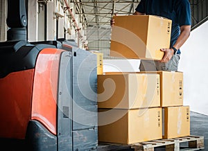 Workers Lifting Packaging Boxes on Pallet. Shipment Boxes. Storehouse. Cargo Warehouse Logistics.