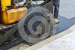 Workers making asphalt with shovels at road construction Asphalt Paving
