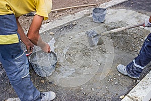 Workers Mixing concrete by hand