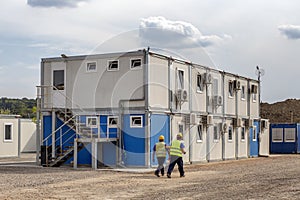 Workers at mobile containers and cabins base