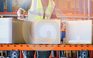 Workers Moving A Package Boxes on Conveyor Belt. Cartons, Parcels Boxes. Storehouse.