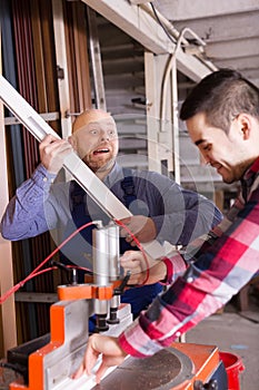 Workers near milling machine