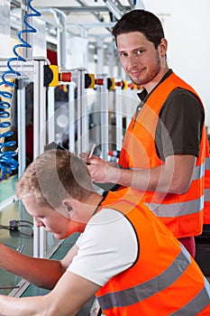 Workers near production line