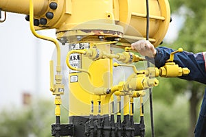 Workers at the oil and gas station. Shut off the gas, control station. Distributor of gas for the population. An innovative