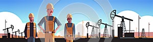 Workers in orange uniform working on oil drilling rig pumpjack petroleum production trade oil industry concept portrait