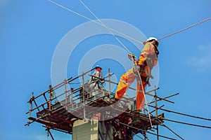 Workers people and safety man sprinkle from up high.