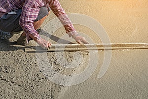 Workers person not wearing dirt boots digging with hoe shovel