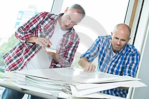 Workers with pile papers
