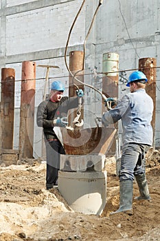 Workers at piling works