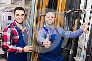 Workers posing in PVC shop