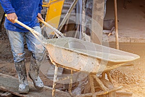 Workers pour concrete in the construction site,Steel bars used for floor construction working ,Workers pour for the construction