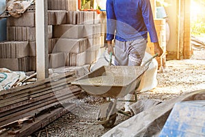 Workers pour concrete in the construction site,Steel bars used for floor construction working ,Workers pour for the construction