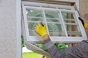 Workers preparing to master removes old wooden windows