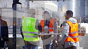 Workers in production plant as team discussing