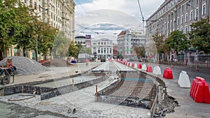 Workers with protective mask welding reinforcement for tram tracks in the city timelapse