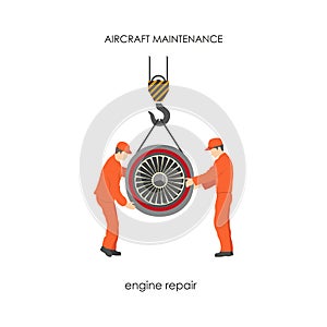 Workers raised the aircraft engine on a lift. Repair and maintenance of aircraft