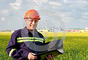 Workers at rapeseed field