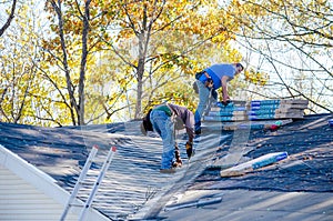 Workers Repairing a roof