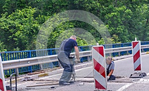 Workers restore the road near the monastery of Moraca.