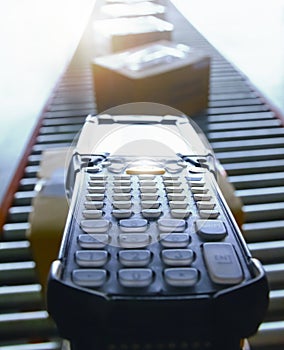 Workers Scanning Bar Code Scanner on Package Boxes on Conveyor Belt. Computer Mobile Work Tools for Inventory Management. Shipping