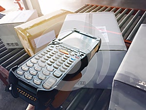 Workers Scanning Bar Code Scanner with Package Boxes on Conveyor Belt. Shipment Boxes. Shipping Storehouse.