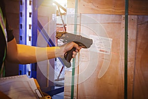 Workers Scanning Bar Code Scanner on Package Label. Storage Shipping Storehouse. Inventory Management