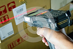 Workers Scanning Bar Code Scanner on Package Label. Storage Shipping Storehouse. Shipment Boxes.