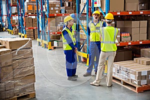 Workers speaking together